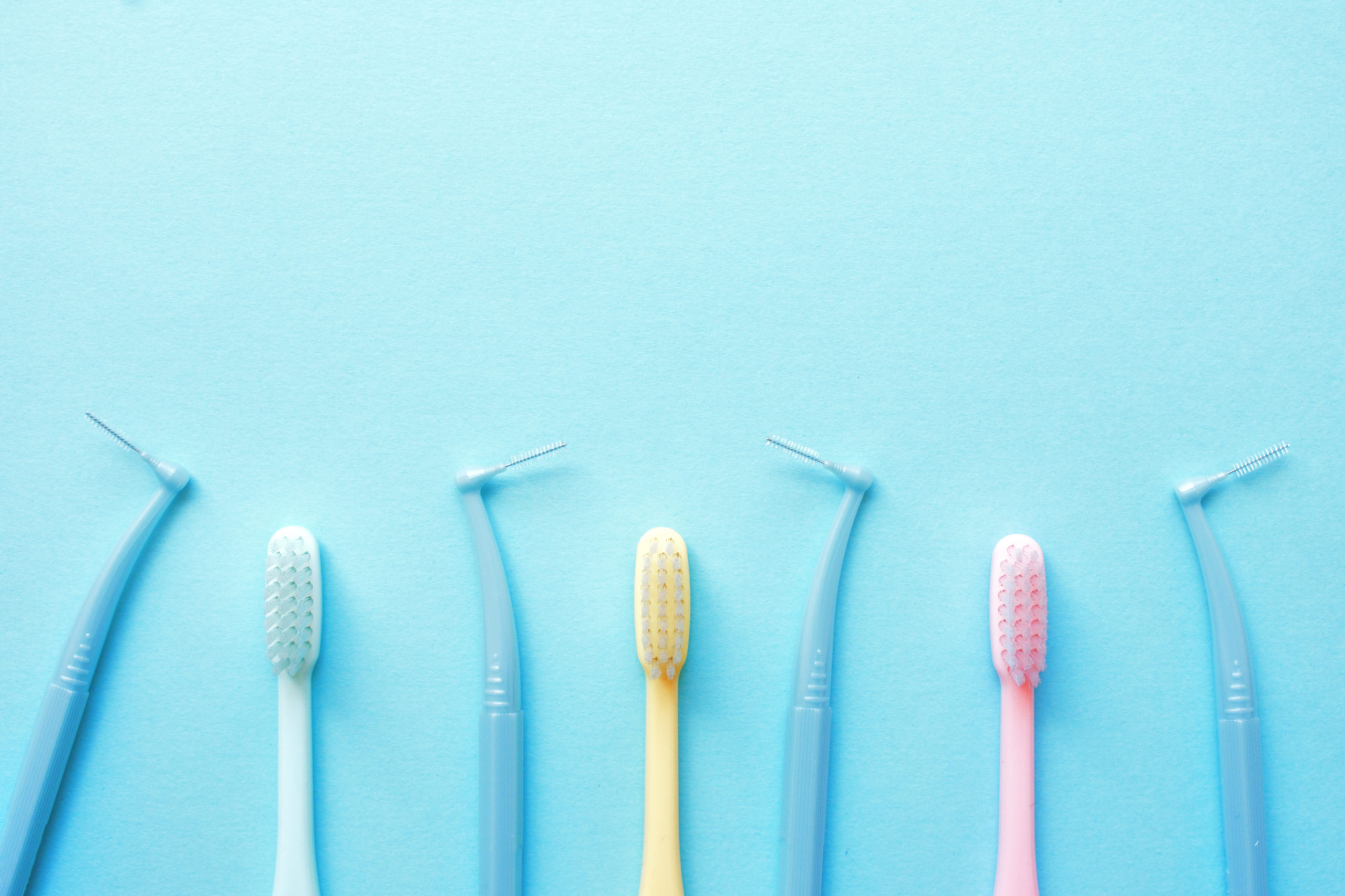 Image of multiple dental picks and tooth brushes