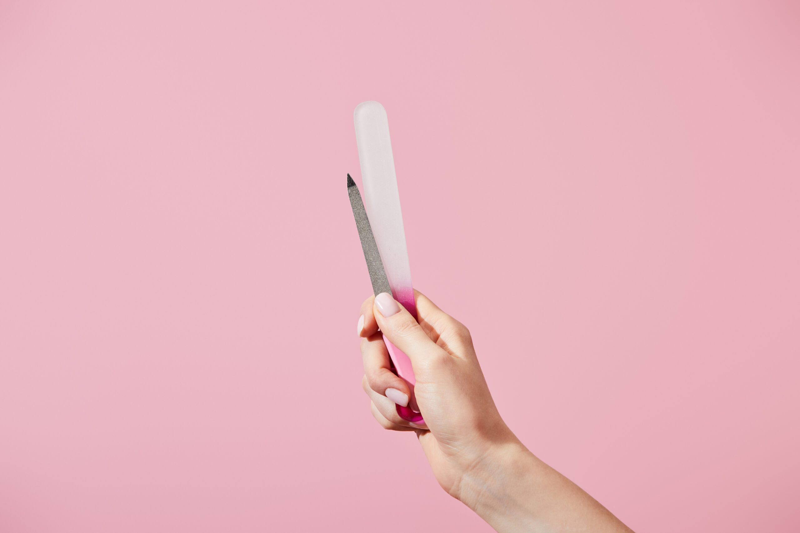 Picture of a woman's hand holding two different types of files