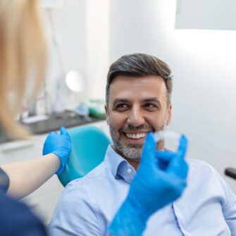 Orthodontist answering questions that are relevant to adult orthodontic treatment.