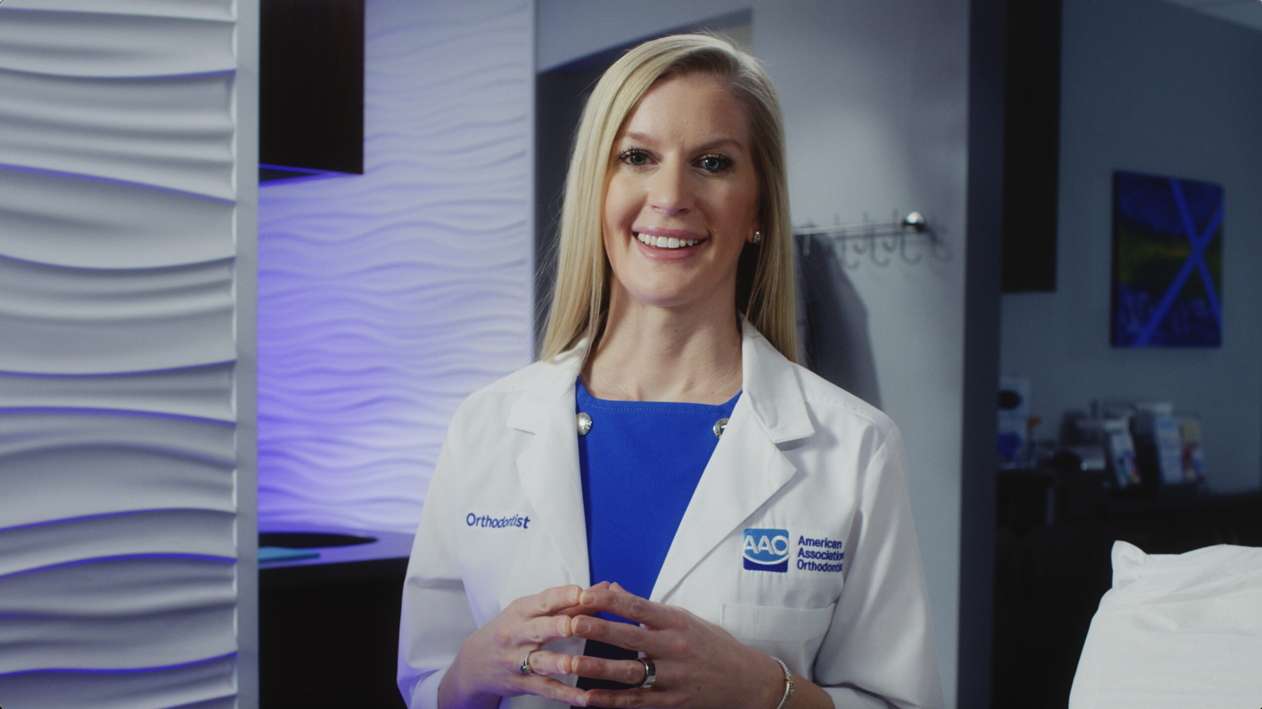 An orthodontist educating patients that any age is appropriate to get orthodontic treatment.