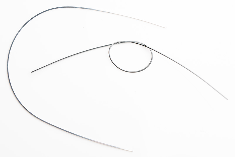 A rectangular archwire, typically used in later stages of orthodontic treatment to control and refine tooth movements.