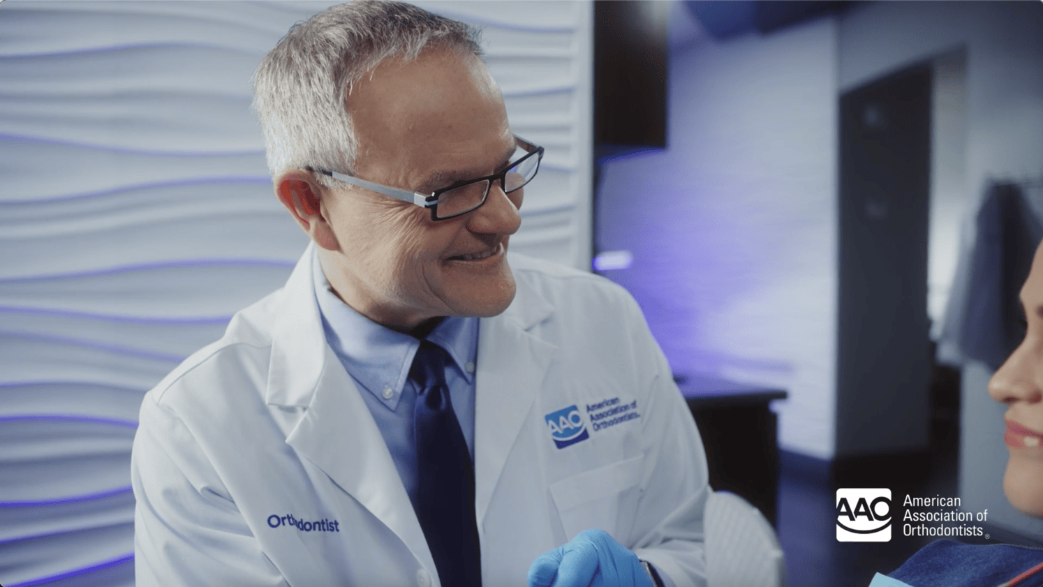 Orthodontist discussing with a patient why in-person exams and x-rays are so important!