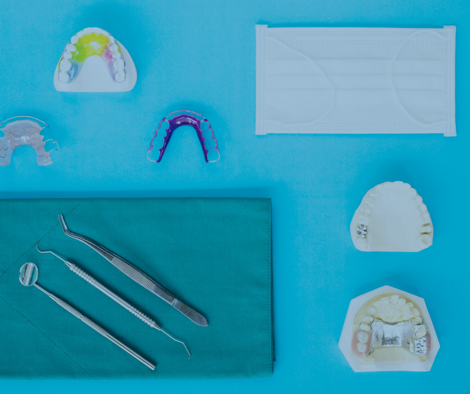 Orthodontic appliances, retainers and teeth molds on a blue background.