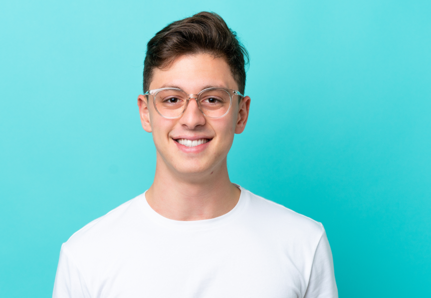 Man smiling, showing off his new straight teeth and healthy bite.